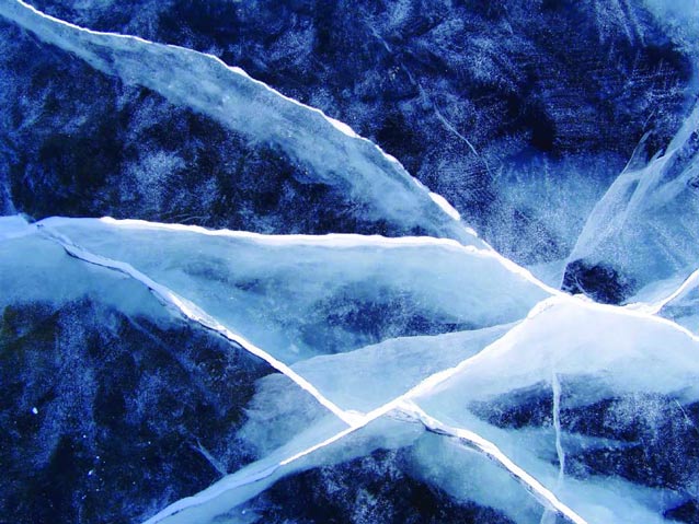 closeup of cracks in bluish ice