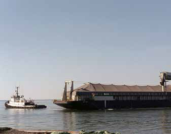 large barge and smaller boat 