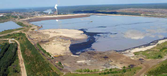 aerial view of a large pond surrounded by dirt roads aerial view of a large pond surrounded by dirt roads