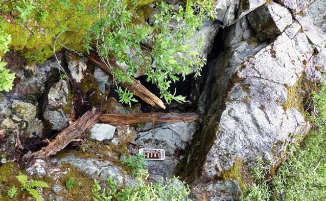 small opening in a jumble of rocks small opening in a jumble of rocks