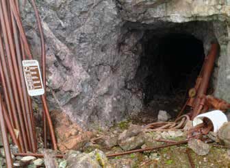 mine entrance cut into a rock wall