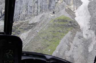 aerial view of small openings in a mountainside aerial view of small openings in a mountainside