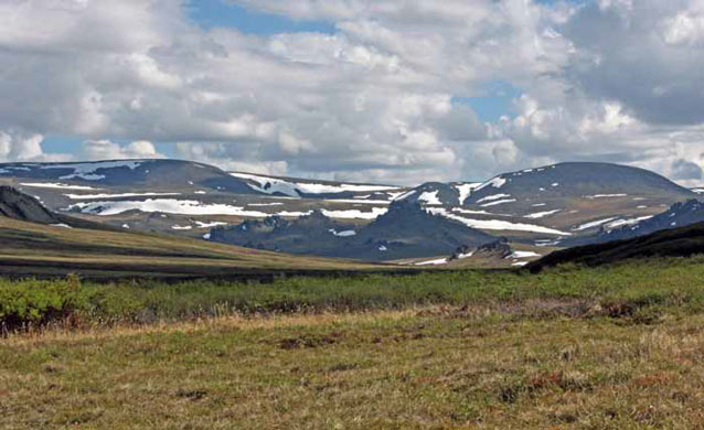 tree-less landscape of hills and mountains