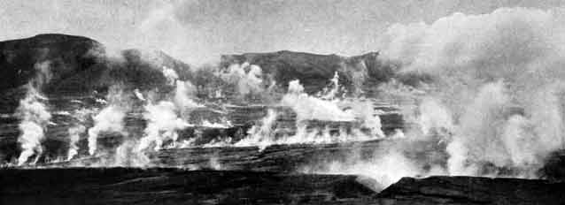 black and white image of smoke rising from a rocky landscape black and white image of smoke rising from a rocky landscape