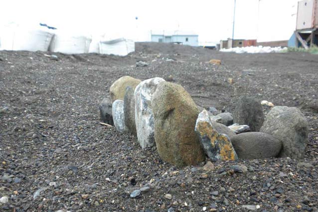 small pile of rocks on a gravel beach