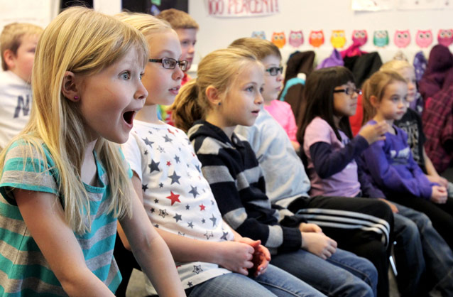 Students watch a program and are excited to learn Students watch a program and are excited to learn
