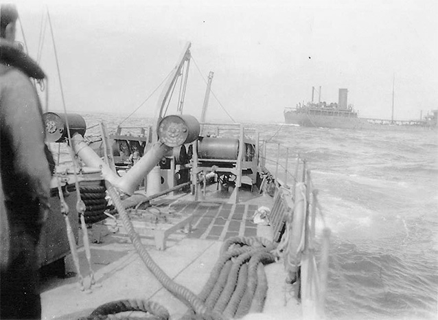 Depth charges visible on the deck of the Dione