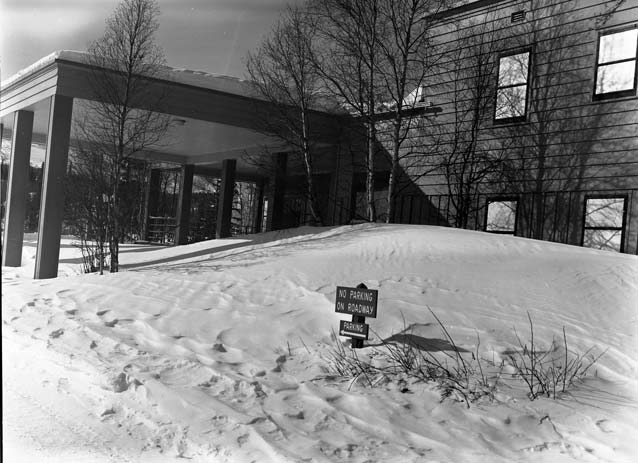 black and white image of a hotel covered in snow black and white image of a hotel covered in snow