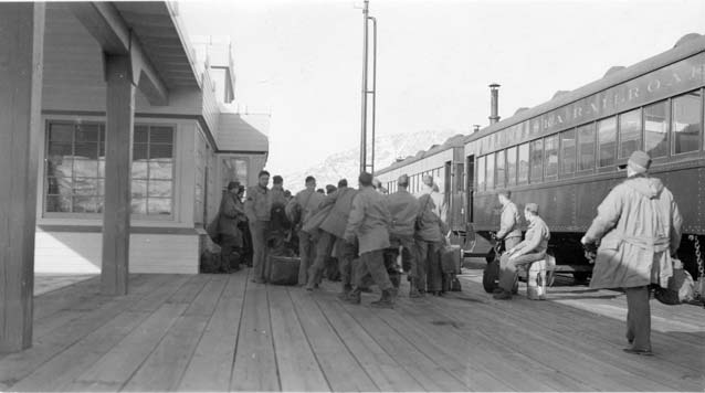 black and white image of soldiers at a train depot black and white image of soldiers at a train depot