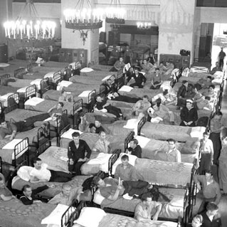B&W Photo of beds line up in Ahwahnee Hotel great room