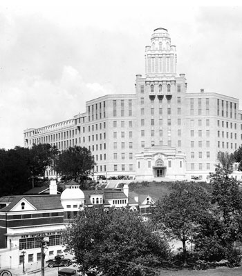 B&W photo of large building in background on hill B&W photo of large building in background on hill