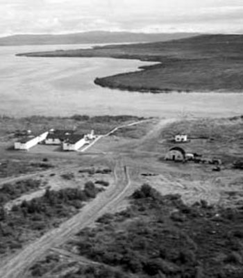 small buildings and dirt roads shown from the air, B&W small buildings and dirt roads shown from the air, B&W
