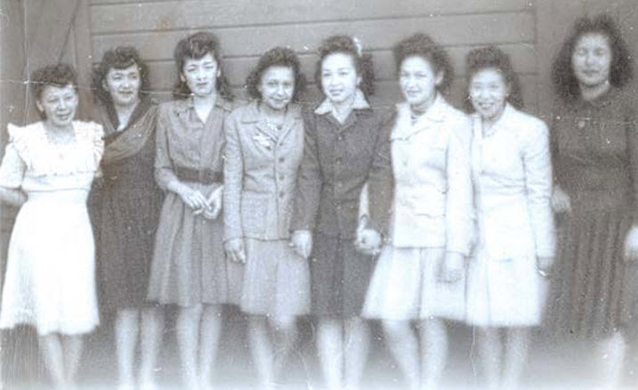 A group of women pose for camera