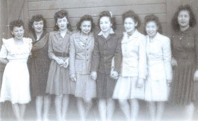 A group of women pose for camera A group of women pose for camera