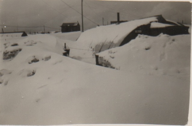 Quonset hut buried in snow