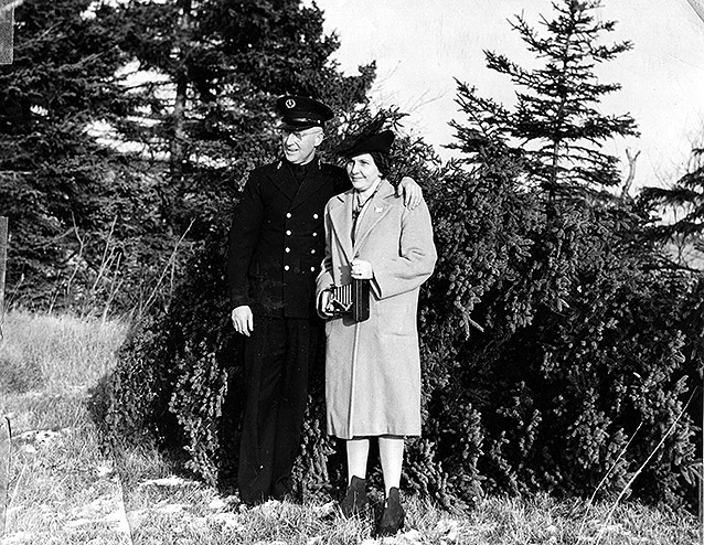 Saint Croix Island lighthouse keeper and wife with Christmas tree for the President.