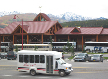 Van driving past the Princess Hotel near Denali National Park Van driving past the Princess Hotel near Denali National Park