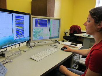AEIC employee monitoring earthquakes in front of a computer. AEIC employee monitoring earthquakes in front of a computer.