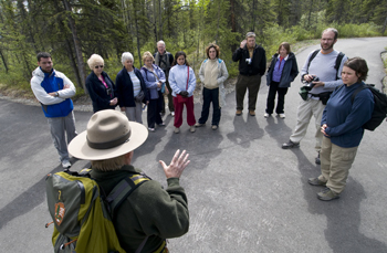 Interpretive ranger talks to a group of Park visitors. Interpretive ranger talks to a group of Park visitors.