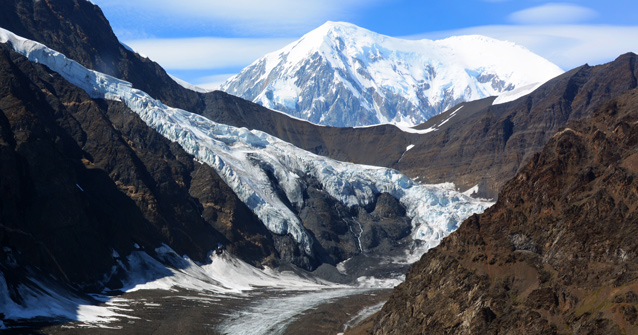 a glacier creeps down a valley