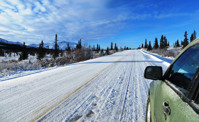 a car sits on a snow covered road a car sits on a snow covered road