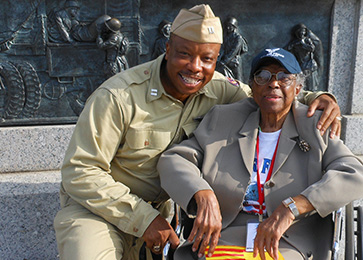 Ranger in uniform poses with Amelie Jones
