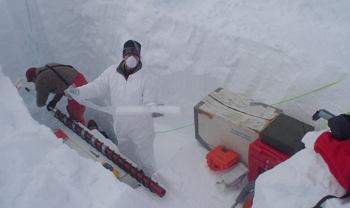 Scientist with a shallow ice core. Scientist with a shallow ice core.