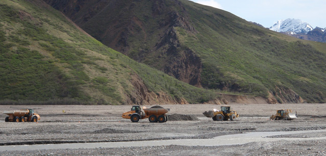 heavy equipment work on a river bar