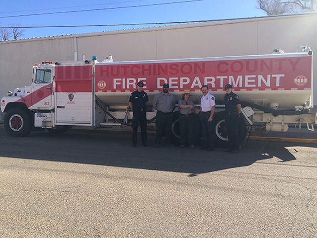 NPS and Fire Department staff with donated water tender NPS and Fire Department staff with donated water tender