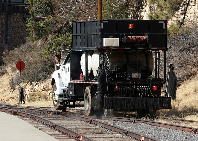 Applying herbicide along railroad tracks within Grand Canyon National Park Applying herbicide along railroad tracks within Grand Canyon National Park
