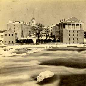 Archival image of the Cataract House with rapids in the foreground.
