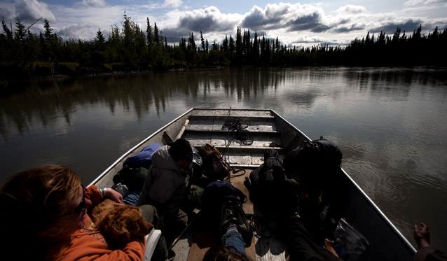 boaters talker while looking out at the Alaskan scenery