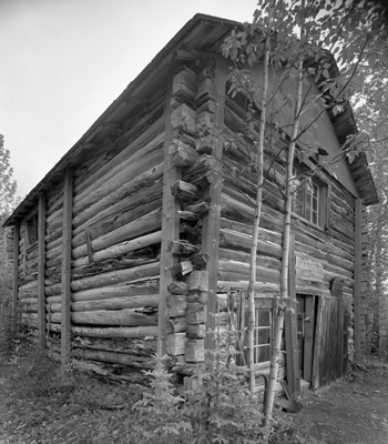 a black and white photo of a historic roadhouse