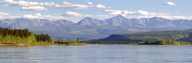 Yukon River with mountains in the background Yukon River with mountains in the background