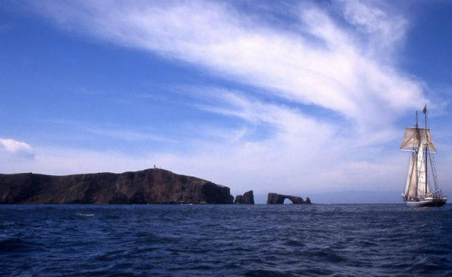 Anacapa Island lighthouse and boat