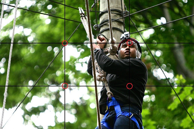 A man on a high ropes course