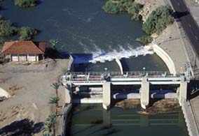 Photo of Laguna Dam on the Colorado River streaming dark blue water