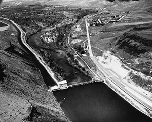 Black and white photo of Bosie Diversion Dam splitting the Boise River in two Black and white photo of Bosie Diversion Dam splitting the Boise River in two
