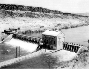 Black and White photo water flowing through the dam