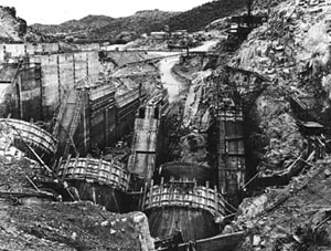 A black and white photo of Bartlett Dam being built 