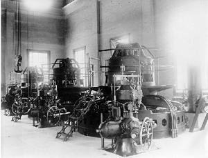 Black and white photo of the interior Boise River Diversion powerplant filled with generators Black and white photo of the interior Boise River Diversion powerplant filled with generators