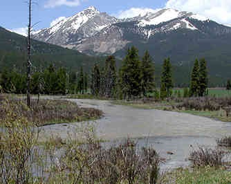 Photo of the Colorado River with mountains in the background 