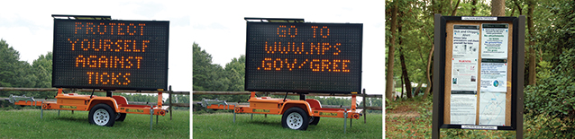 Bulletin board and portable, trailer-mounted signs displaying messages about tick exposure risks