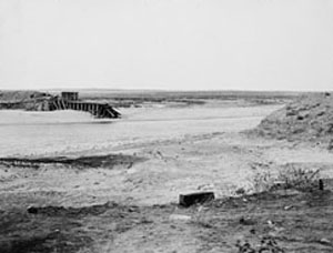 Black and white photo of flood water destroying Avalon Dam 