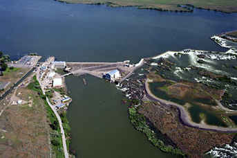 Sky view of Minidoka Dam and Minidoka Powerplant surrounded by water Sky view of Minidoka Dam and Minidoka Powerplant surrounded by water