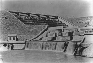 Black and white photo of Lahontan Dam's spillway over flowing with water