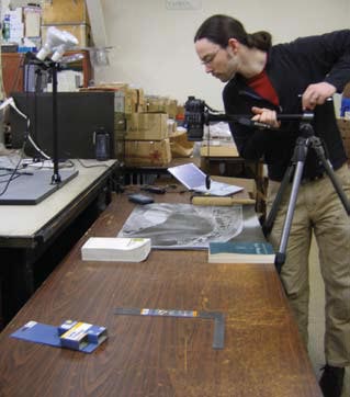 A man documenting Giddings’ site location information. A man documenting Giddings’ site location information.