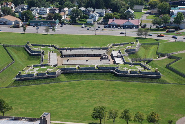 An aerial view shows the fort landscape in relation to surrounding development.