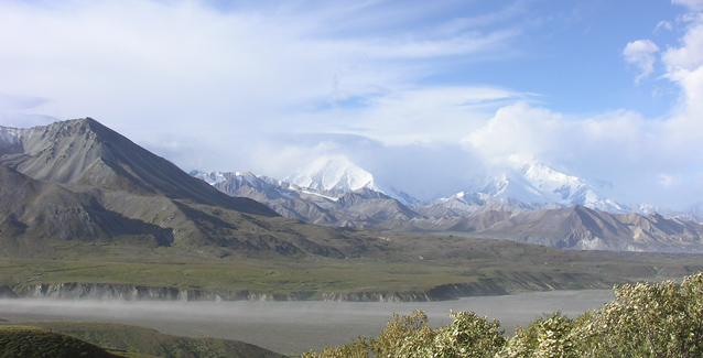 Mountains of the Alaska range are hidden behind clouds