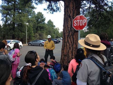 Fire management officer briefs a group of 4th grade students Fire management officer briefs a group of 4th grade students